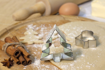 Christmas baking cookies with tree shape on blurred background