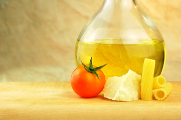 Raw tortiglioni pasta with parmesan, cherry tomato and olive oil