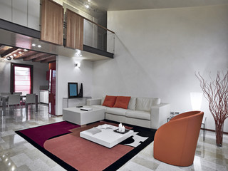 soggiorno moderno con divano e poltrone di pelle