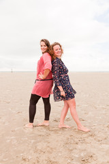 Two pretty young women enjoying outdoor near the beach.