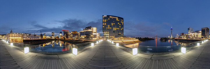 Düsseldorf at dusk. 360 degree panoramic composition.