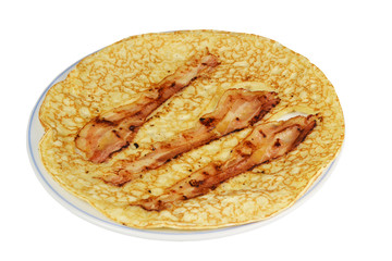 A board with a pancake with bacon strips on a white background.