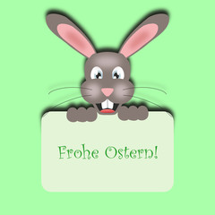 Lustiger Osterhase hält Schild