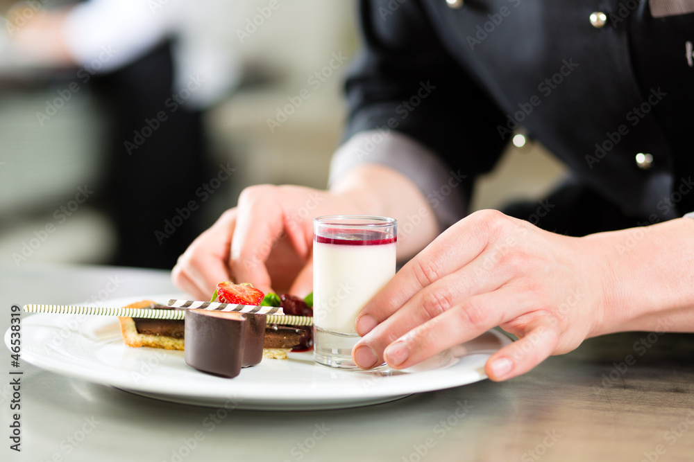 Wall mural chef as patissier cooking in restaurant dessert