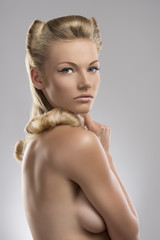 portrait of naked blonde girl turned at right