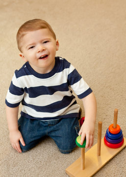 Developmentally Delayed Child With Stacking Toy