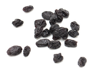 black raisins on a white background