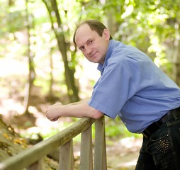 Happy aged man in the forest