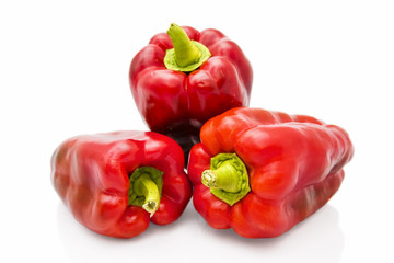 Three red pepper isolated on white background
