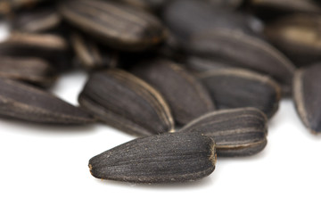 black seeds on a white background. macro