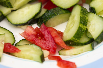 sliced ​​cucumbers and tomatoes