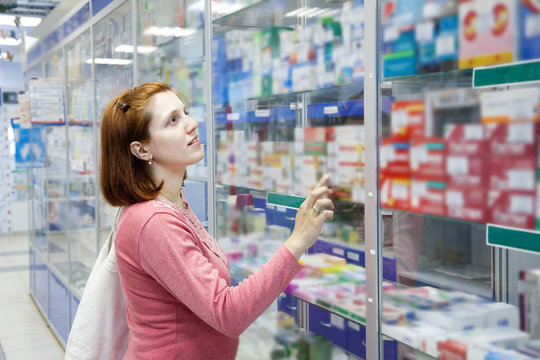 Woman in pharmacy drugstore