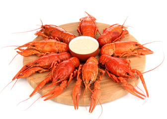 Tasty boiled crayfishes on chopping board isolated on white