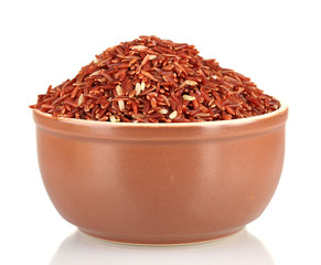 red rice in a brown  plate , isolated on white