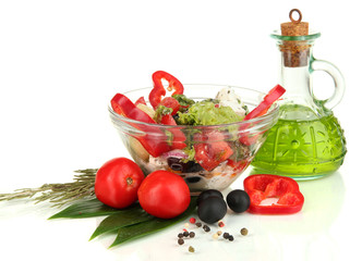 Fresh greek salad in glass bowl isolated on white