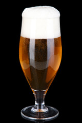 Glass of beer isolated on black
