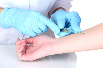 vaccine injection in hand isolated on white