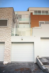 Modern architecture exterior detail with garage doors