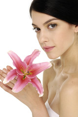 portrait of a young sexy woman with a lily flower.