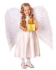 Child at angel costume holding gift box.