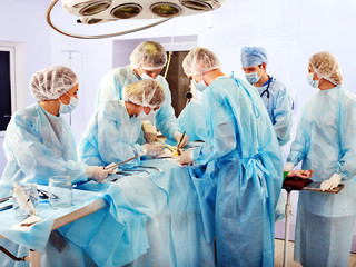Surgeon at work in operating room.