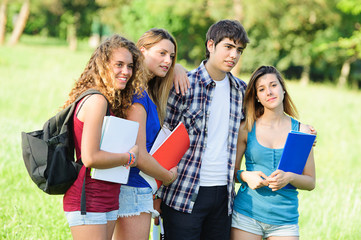 Fototapeta na wymiar Portrait happy young students in park