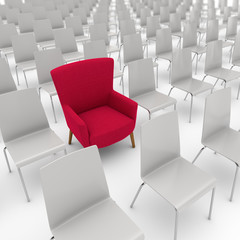 Roter Sessel zwischen den St&uuml;hlen