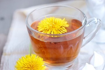 tea in glass cup and flowers