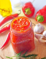 Fototapeta na wymiar Fresh chilli sauce in the glass bank