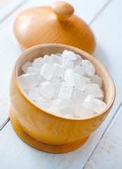 White sugar in the wooden vase