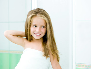 Cute little girl washing