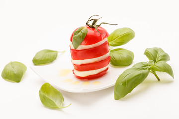 tomato and mozzarella slices decorated with basil leaves