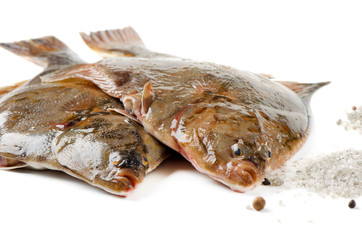 Two flounder with salt