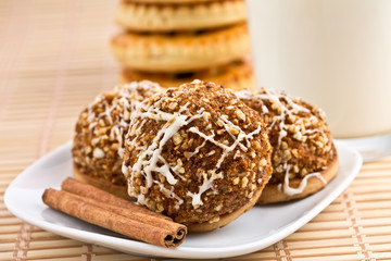 cookies and cinnamon sticks on a plate