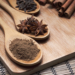 Herbs and Spices over wooden background