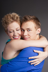 Young beautiful couple in the studio
