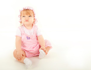 studio shot of blond little baby girl