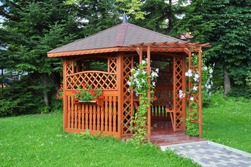 Gazebo in the garden - wooden house © marcincom