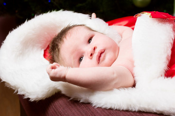 Obraz premium Newborn baby sleeping. Xmas team