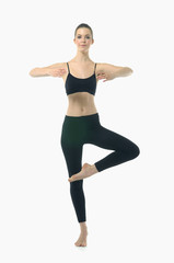 Fototapeta na wymiar beauty woman in black stand in yoga Dancer Pose