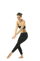 pretty woman in black sportswear practicing yoga