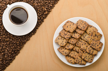 A cup of coffee and cookies