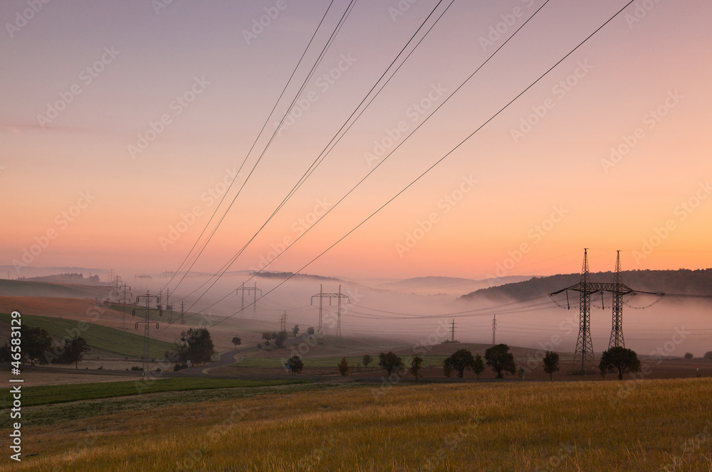 Wall mural the fallow fields in autumn in the mist at sunrise