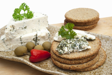 Cheese roule with herbs and crackers