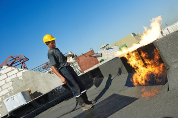 Flat roof covering repair works with roofing felt