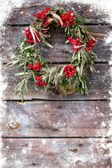 christmas wreath  on a rustic wooden wal