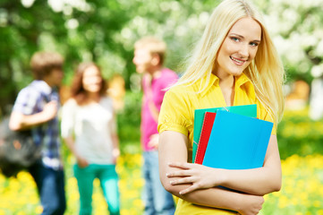 Fototapeta premium smiling student girl outdoors