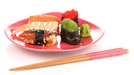 delicious sushi served on red plate isolated on white
