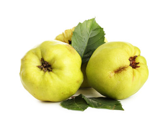 sweet quinces with leaves, isolated on white