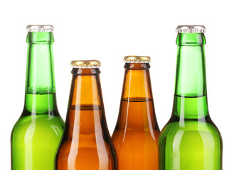 Coloured glass beer bottles isolated on white